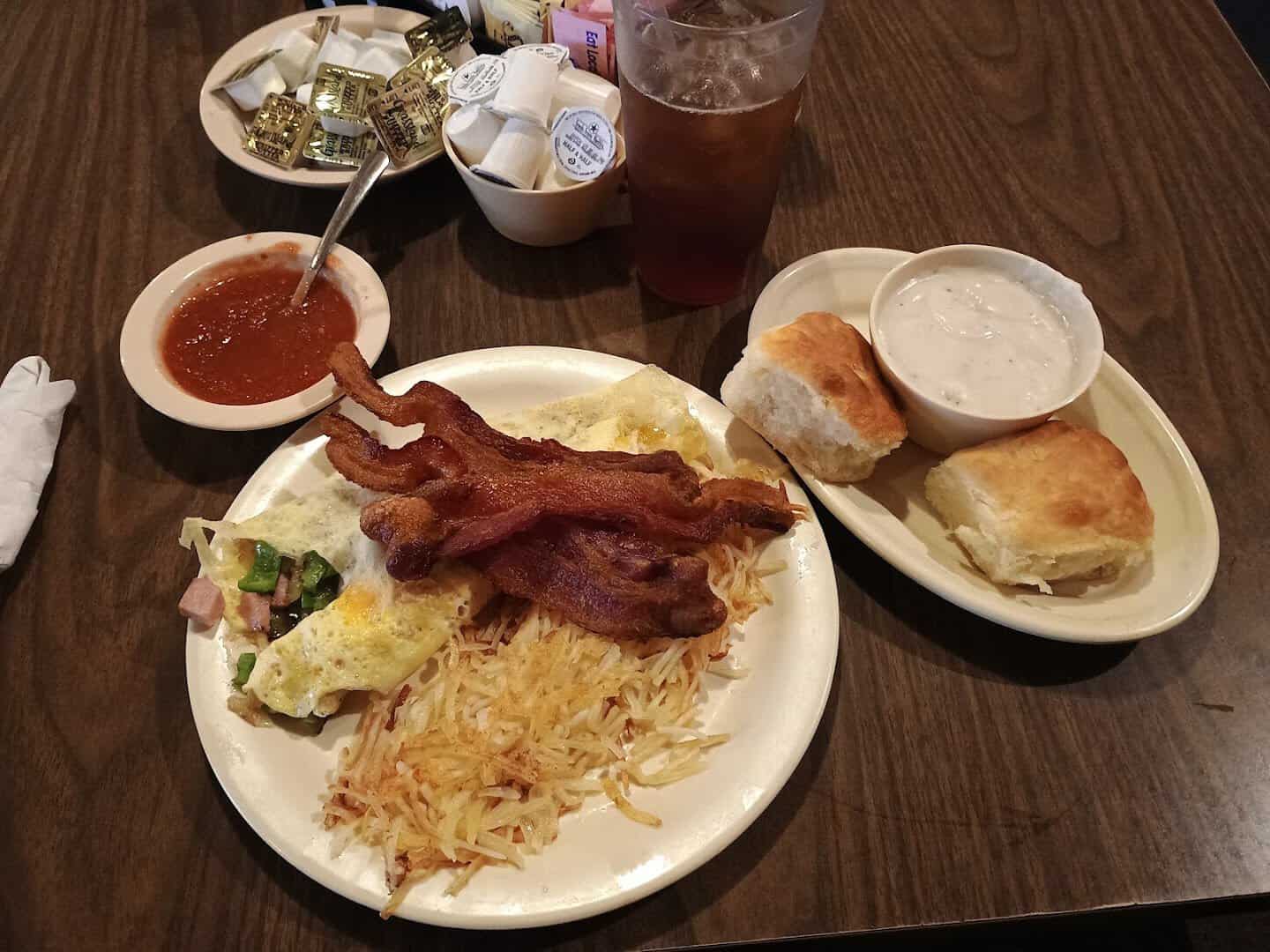 Bacon, eggs, hashbrowns, and a biscuit breakfast plate at The Coffee Shop Cafe in McGregor