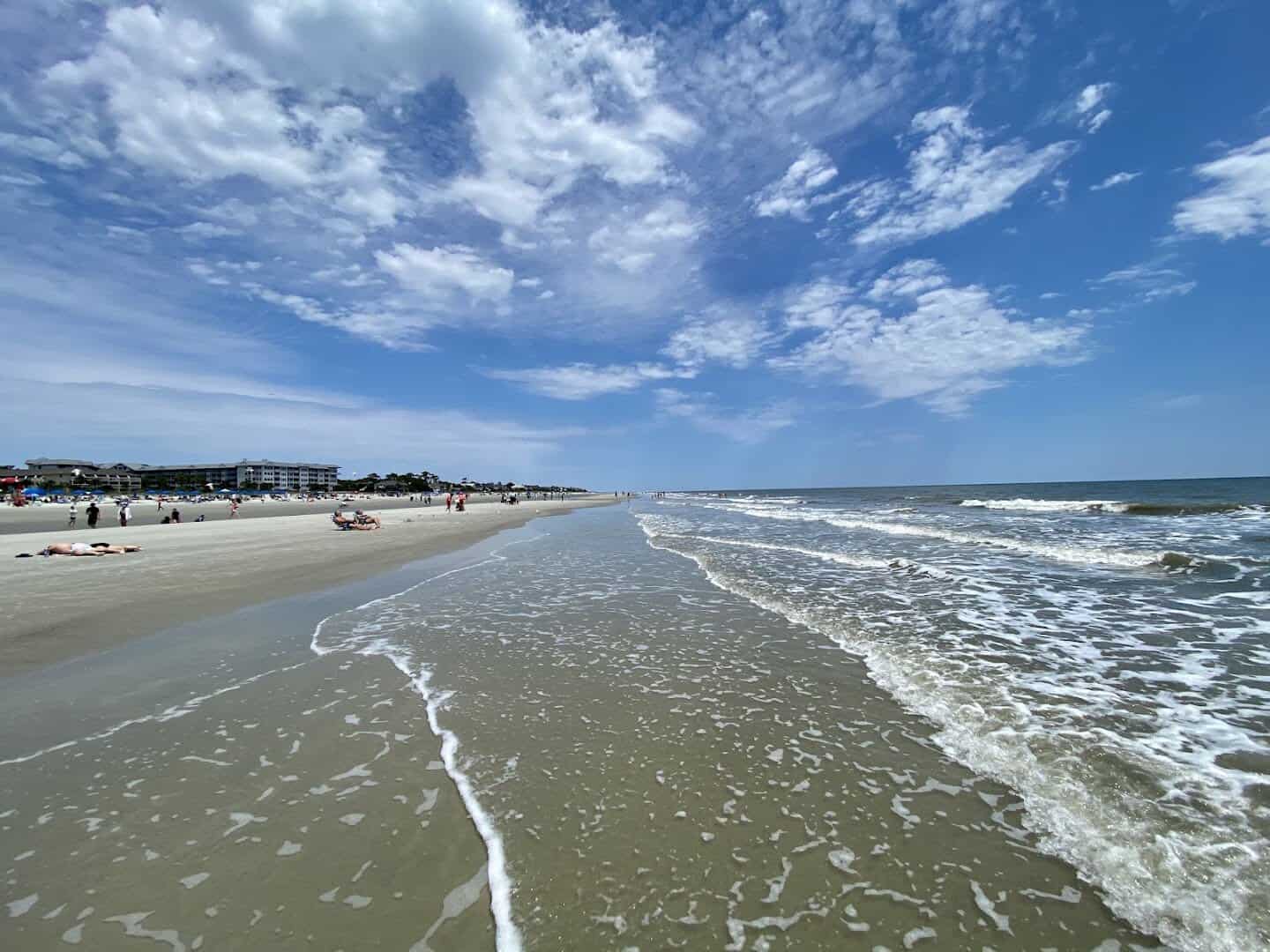 Wide firm sand and gentle surf at Coligny Beach on Hilton Head Island, South Carolina