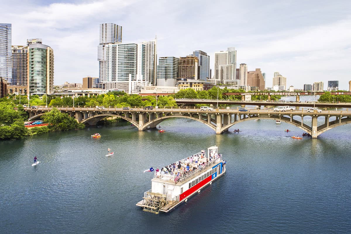 The Congress Avenue Bridge over Lady Bird Lake with downtown Austin behind it