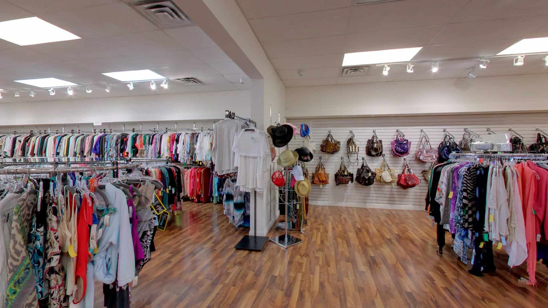 Racks of designer clothing and a wall of handbags inside Clotheshorse Anonymous in Dallas