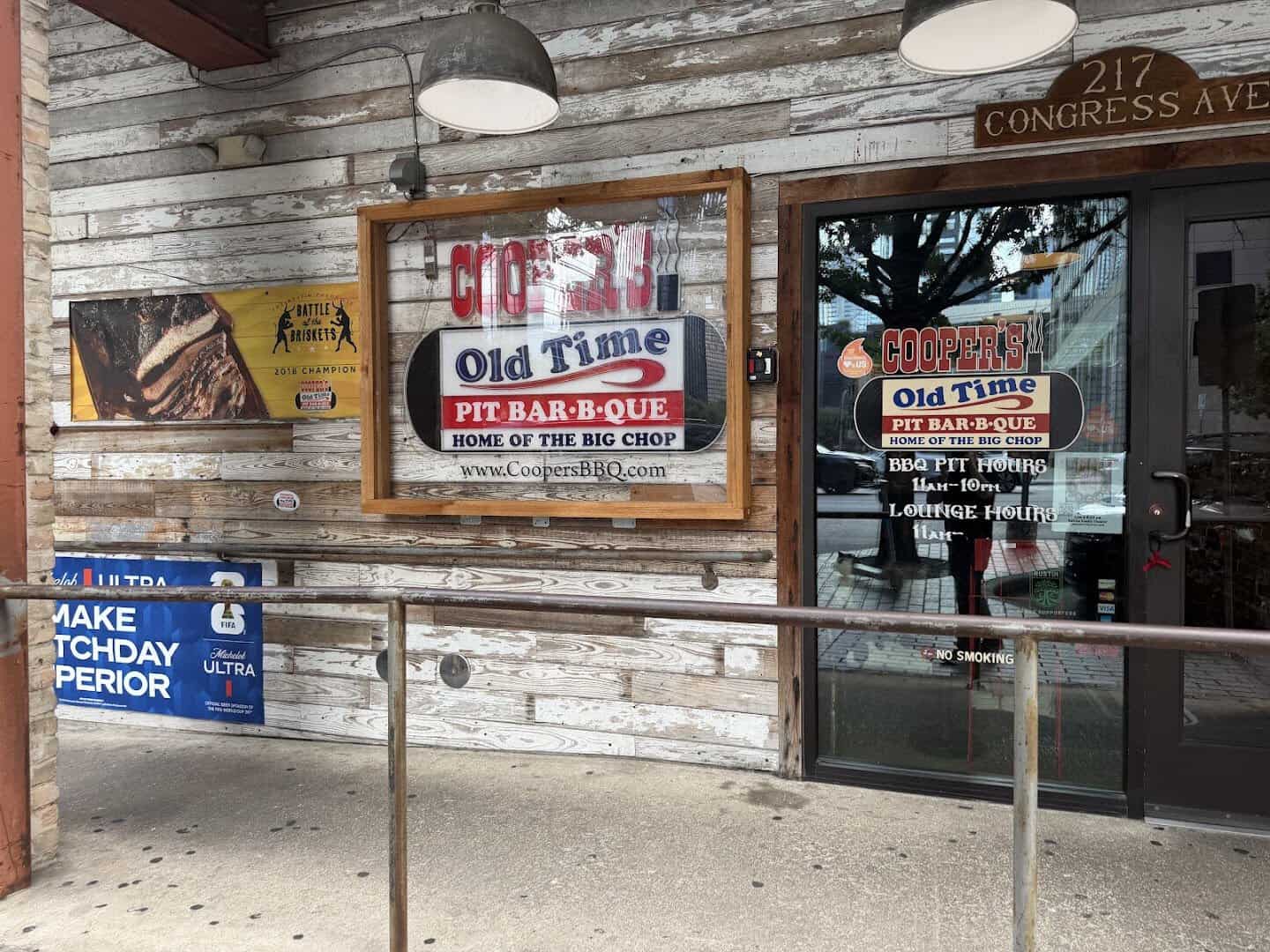 Cooper's Old Time Pit Bar-B-Que entrance sign at 217 Congress Avenue in Austin