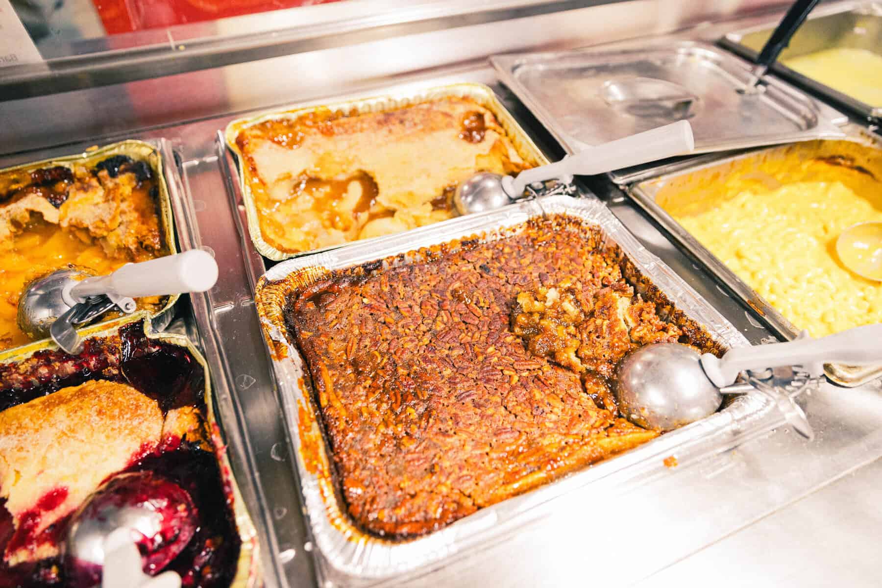 Peach, blackberry and pecan cobblers on the dessert bar at Cooper's Old Time Pit Bar-B-Que in Austin