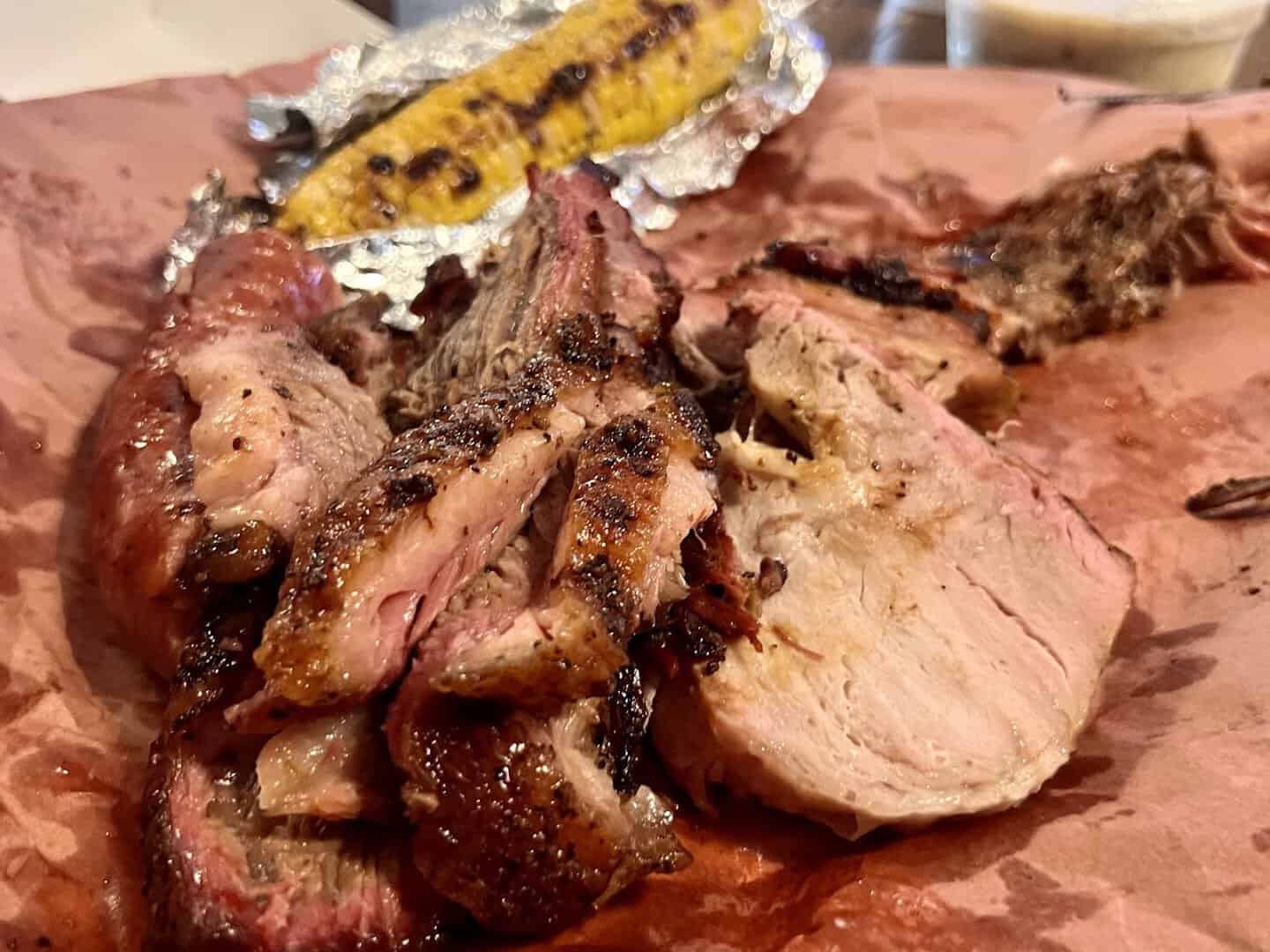 Close-up of sliced smoked meats and sausage on butcher paper at Cooper's Old Time Pit Bar-B-Que in Austin