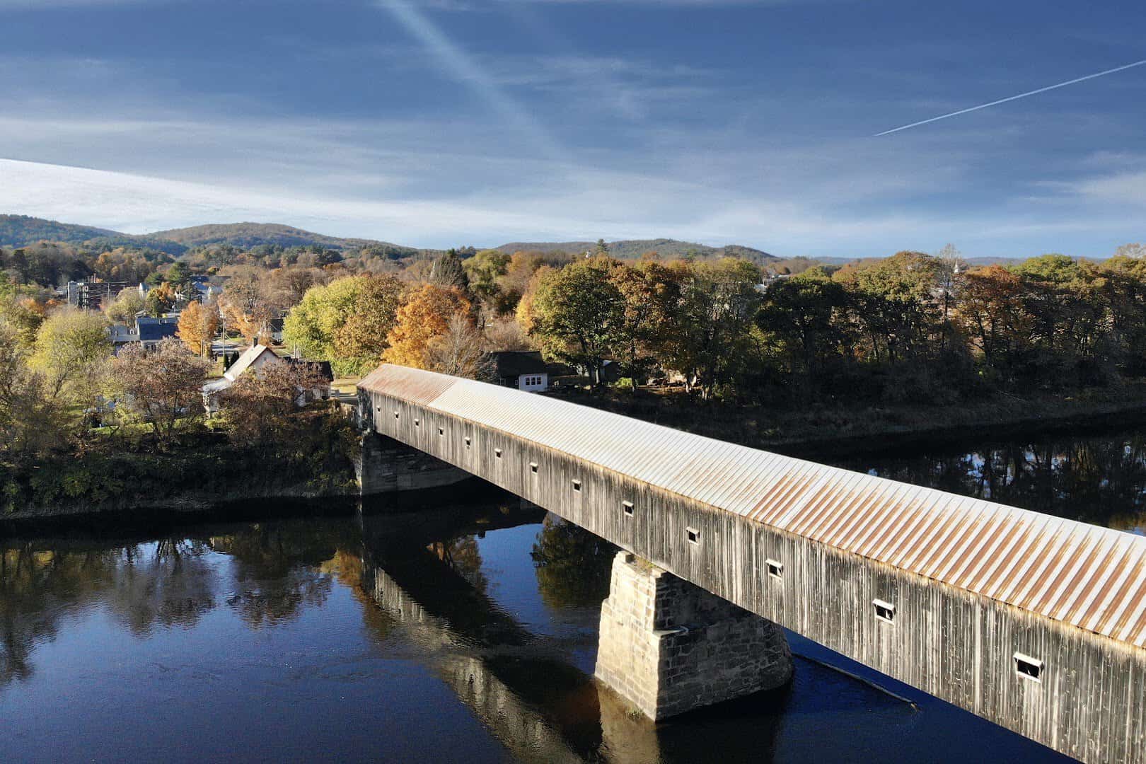 Cornish-Windsor Covered Bridge over the Connecticut River in fall foliage, New Hampshire