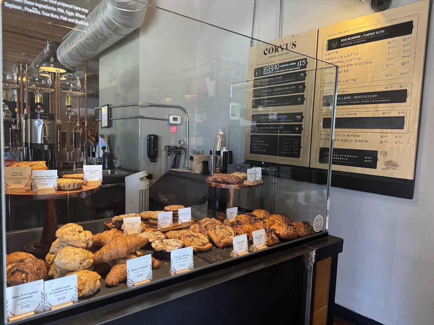 Pastry case and menu at Corvus Coffee Roasters in Denver