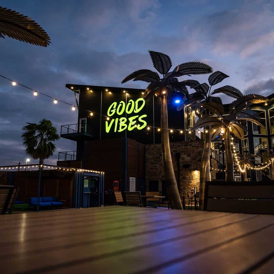 Illuminated Good Vibes sign at The Cove at BearX in College Station, Texas