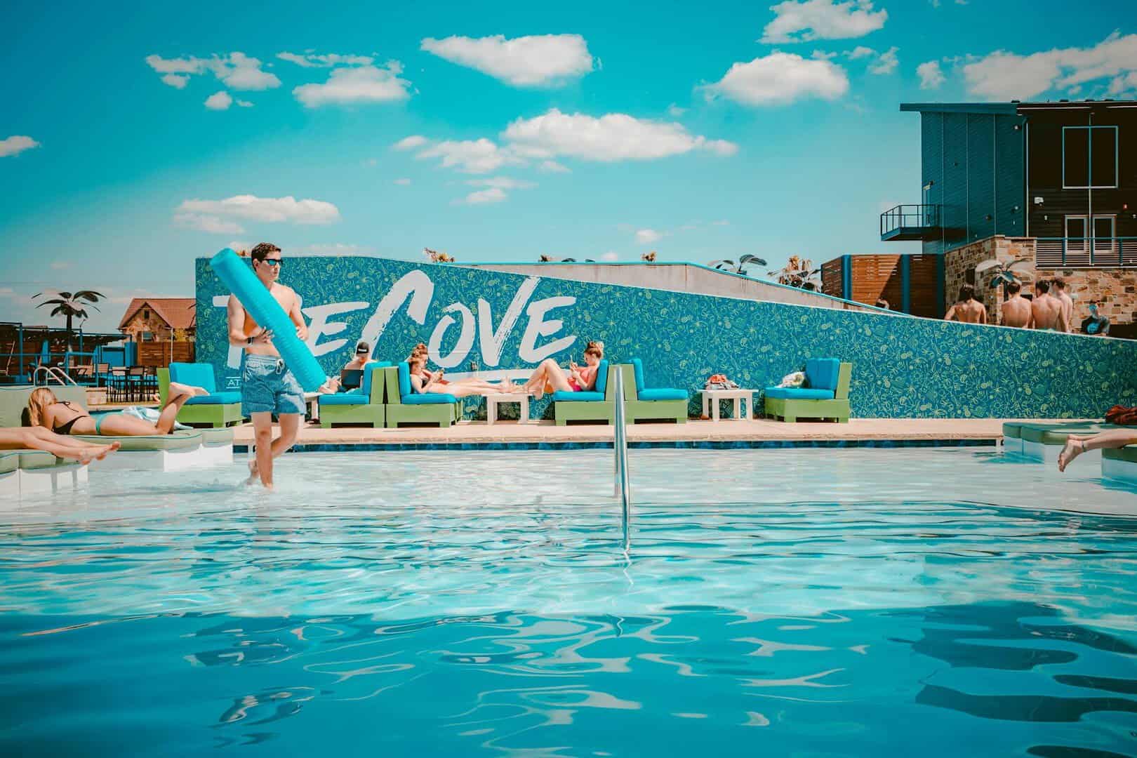 Pool and The Cove sign at The Cove at BearX in College Station, Texas