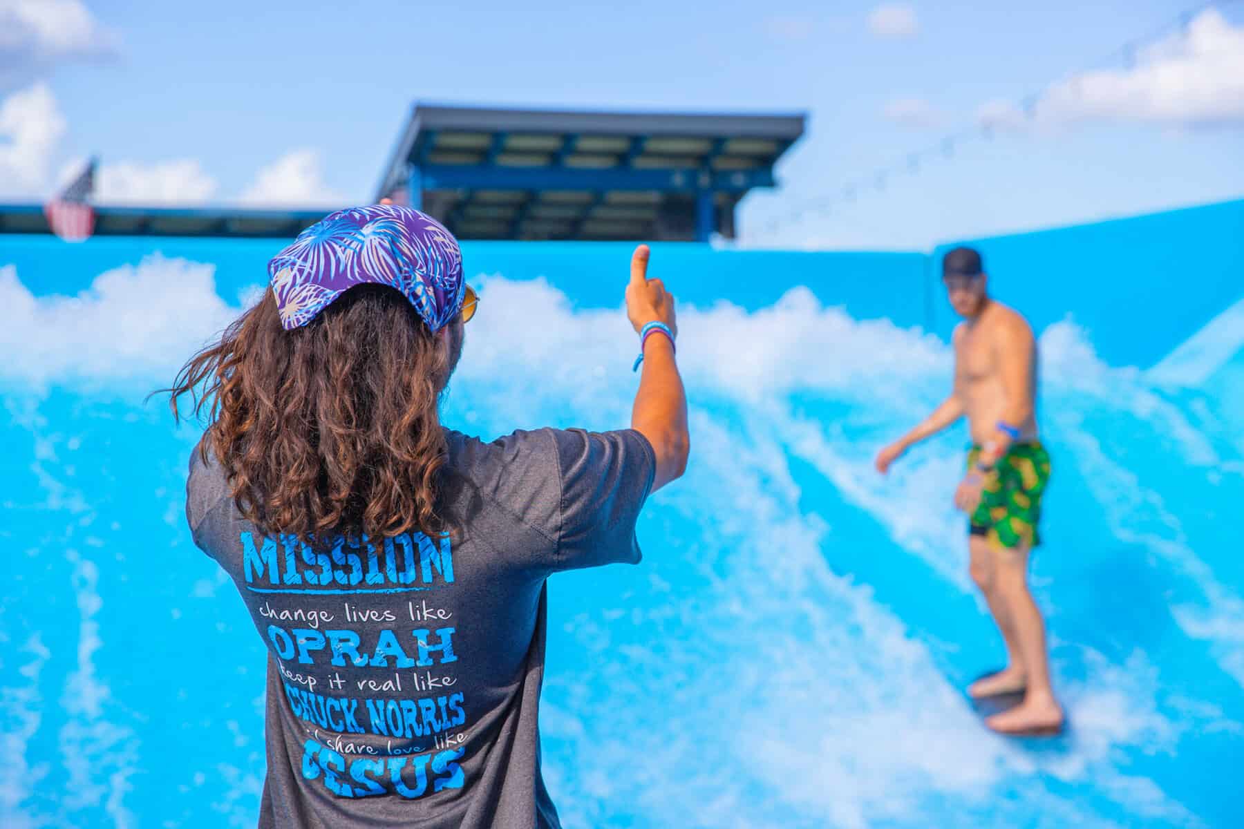 Rider on the ProFlow surf machine at The Cove at BearX in College Station, Texas