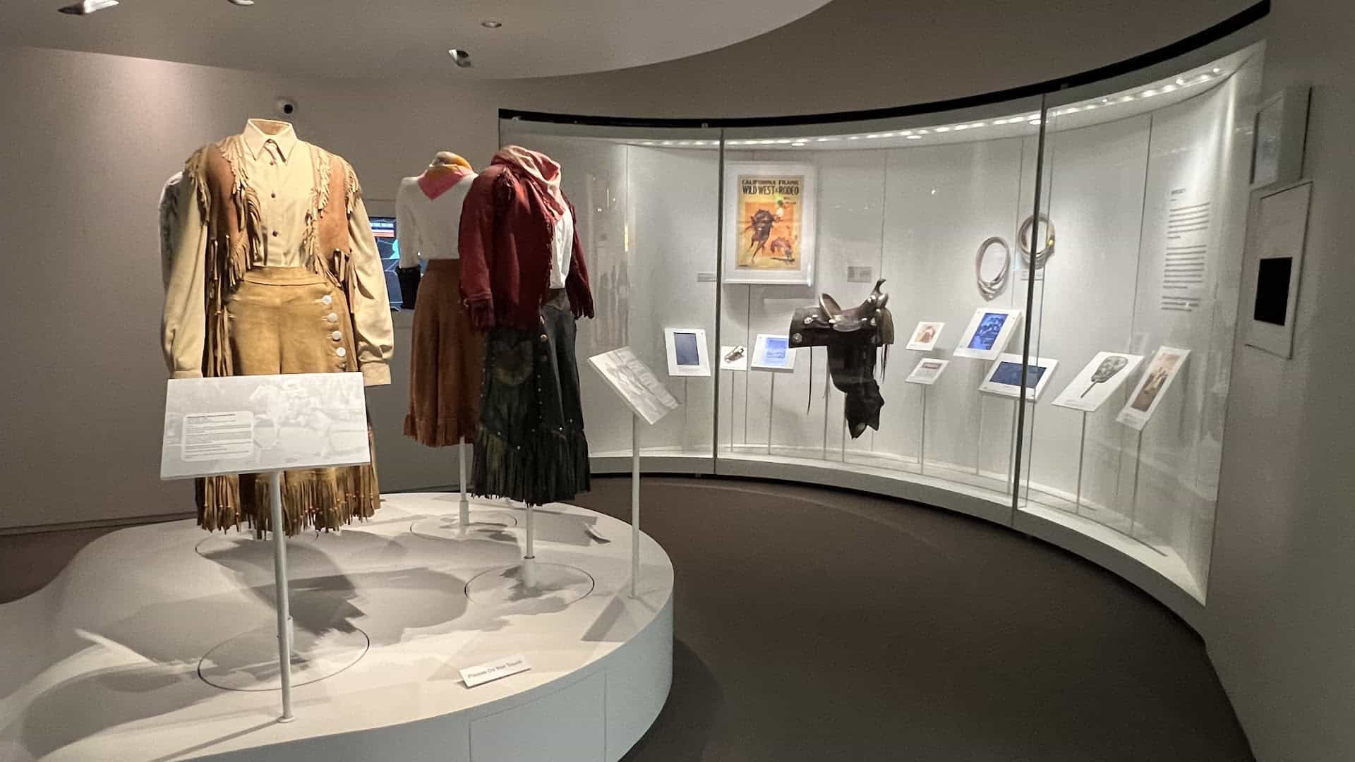 Western costumes on mannequins in a gallery at the National Cowgirl Museum in Fort Worth