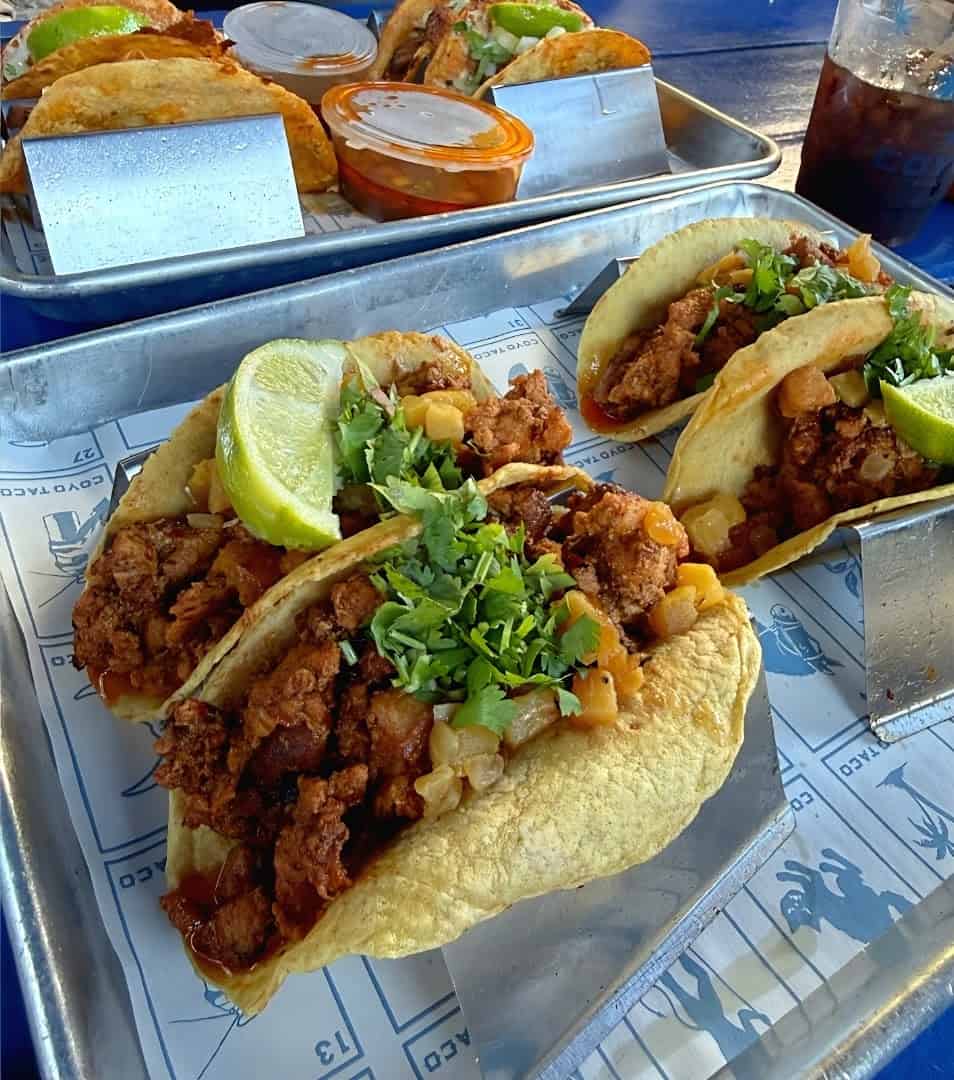 Al pastor tacos on a tray at Coyo Taco in Miami