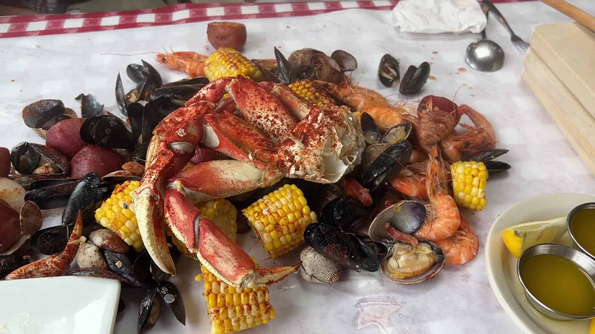 Crab and shrimp boil poured over the paper-covered table at The Crab Pot in Seattle, Washington
