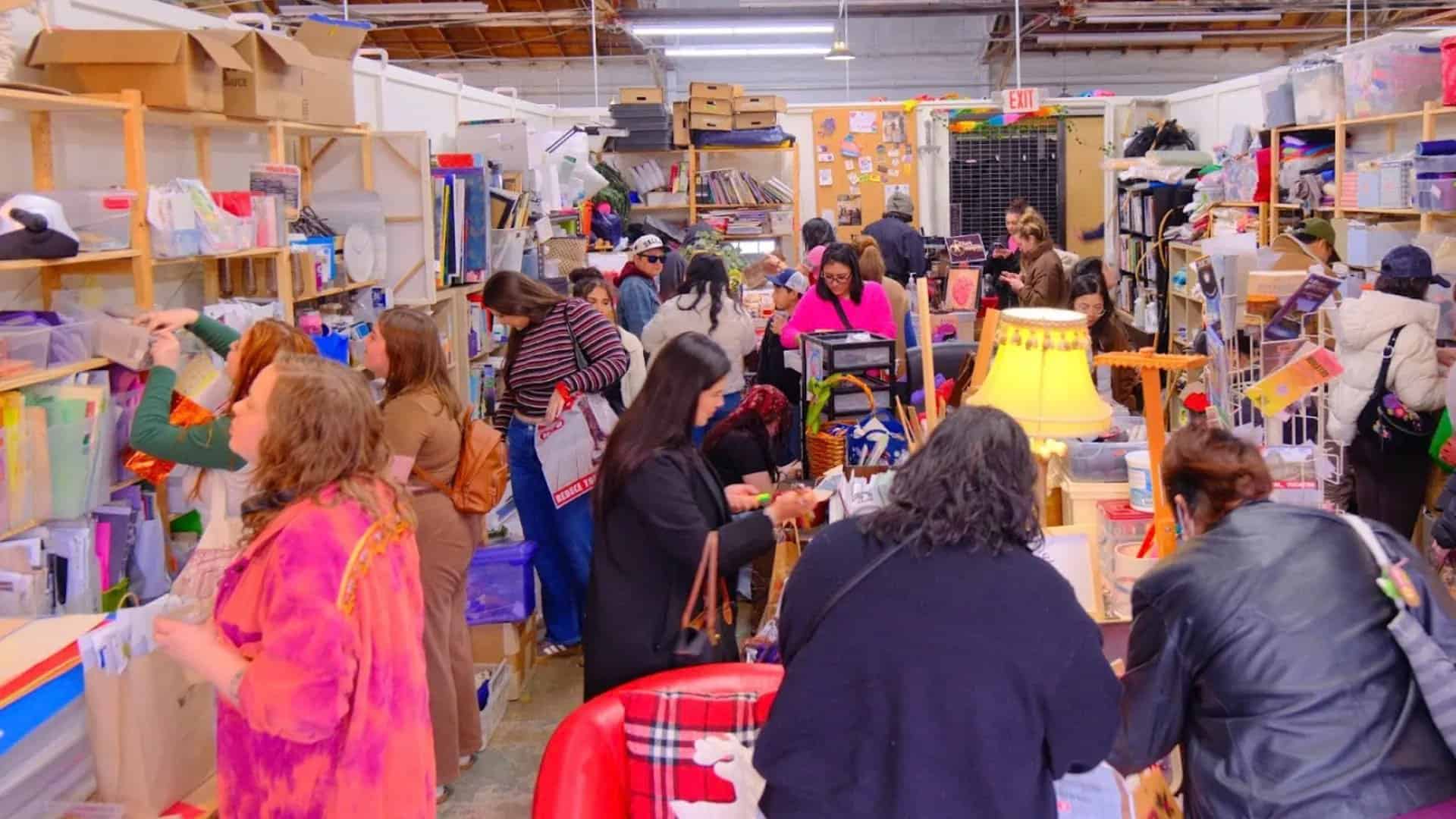 Shoppers browsing the aisles at Pegasus Creative Reuse in Dallas