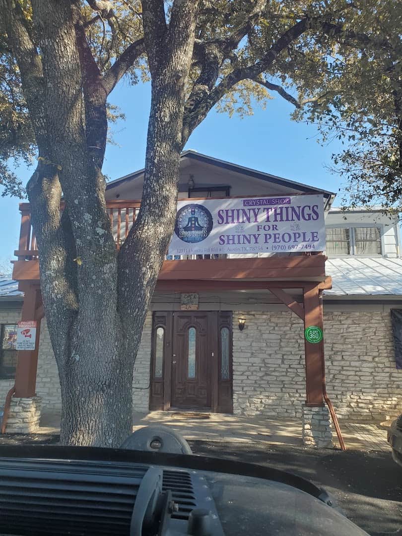 Exterior sign for Shiny Things For Shiny People crystal shop on South Lamar in Austin