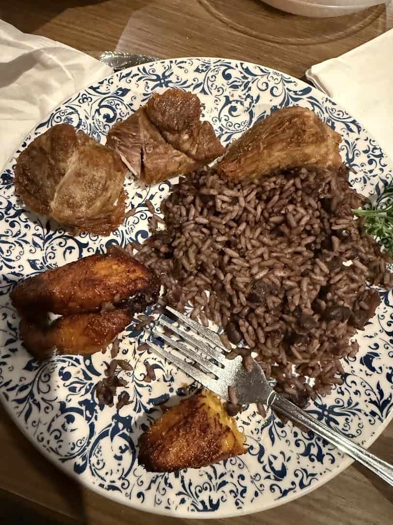 A Cuban plate of fried meat with moros rice and beans at Cafe Piquet in Bellaire, Texas