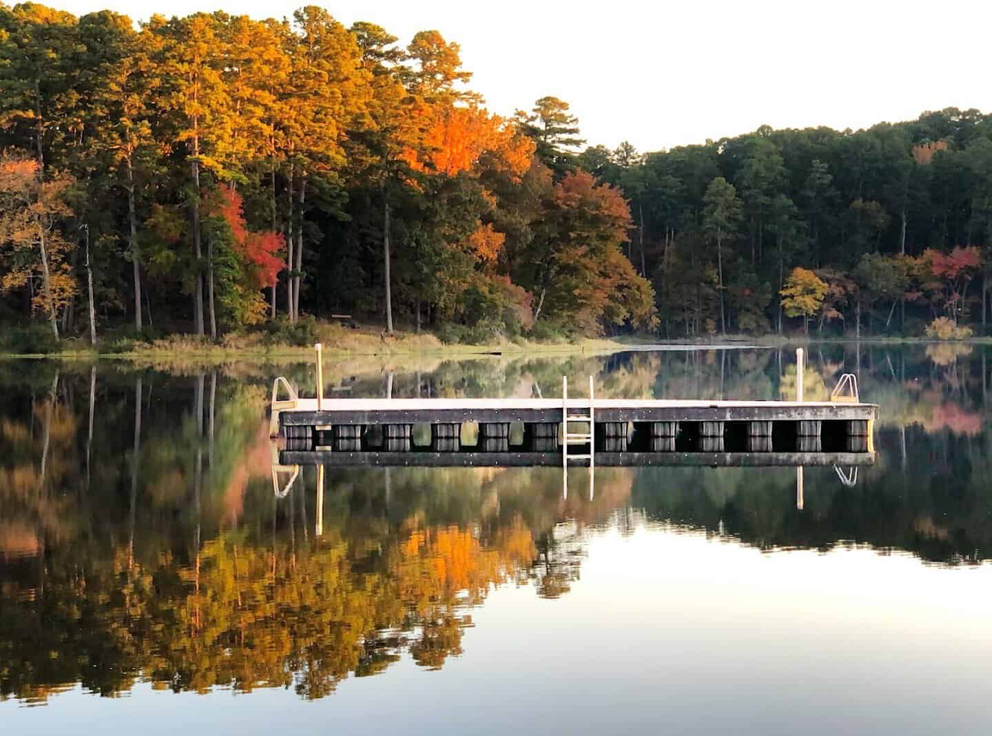 Fishing dock over the calm autumn lake at Daingerfield State Park, Texas