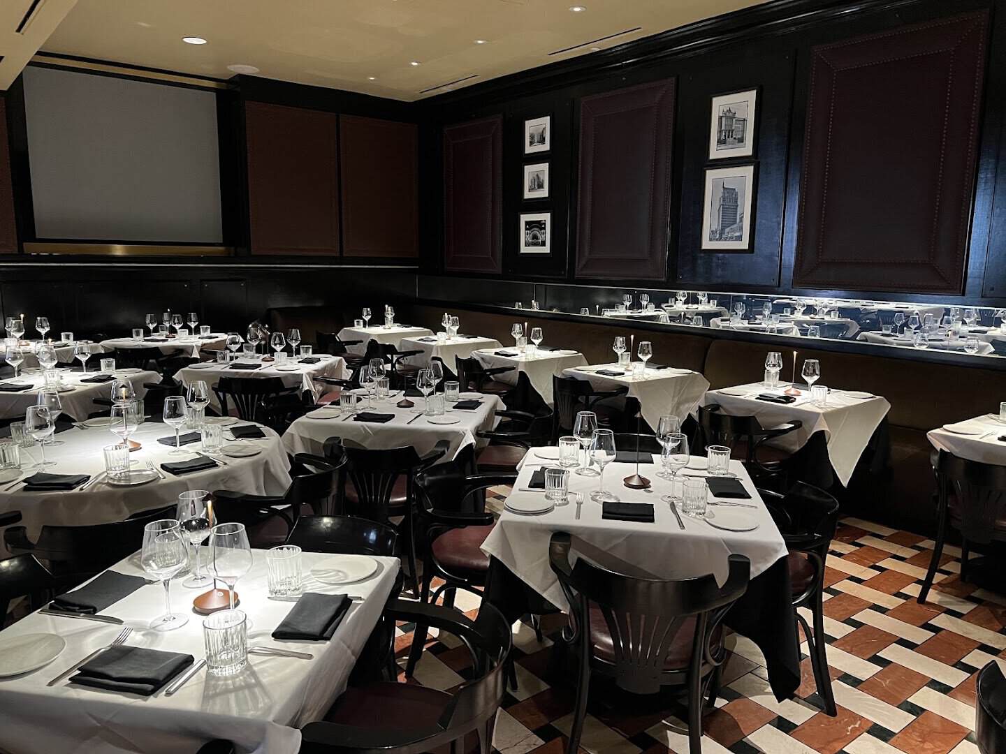 Dining room with black and white photographs at Dakota's Steakhouse in Dallas