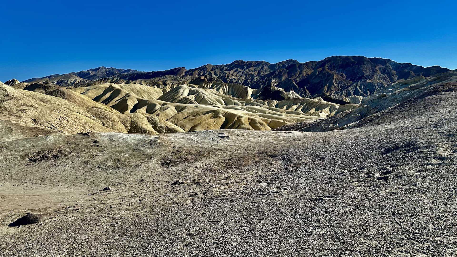 Golden eroded badlands at Death Valley National Park, California