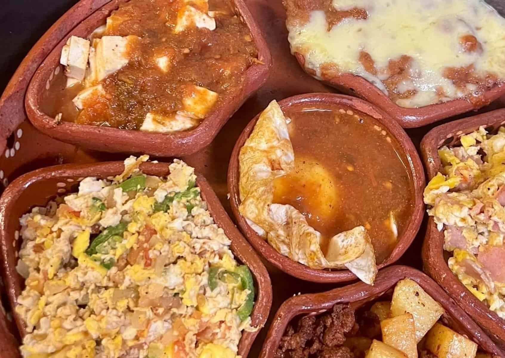 A spread of Mexican dishes in clay bowls in Del Rio, Texas