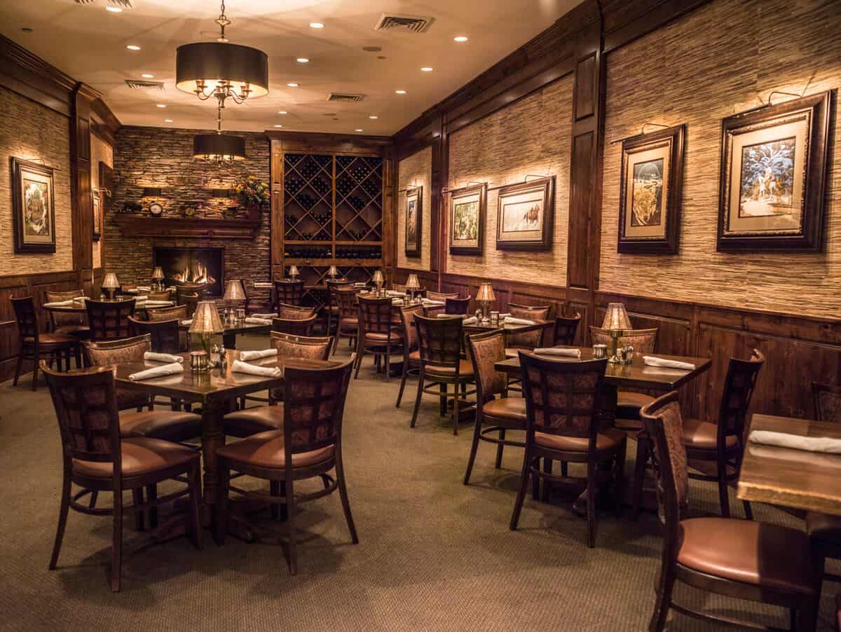 The wood-paneled dining room at Taste of Texas in Houston