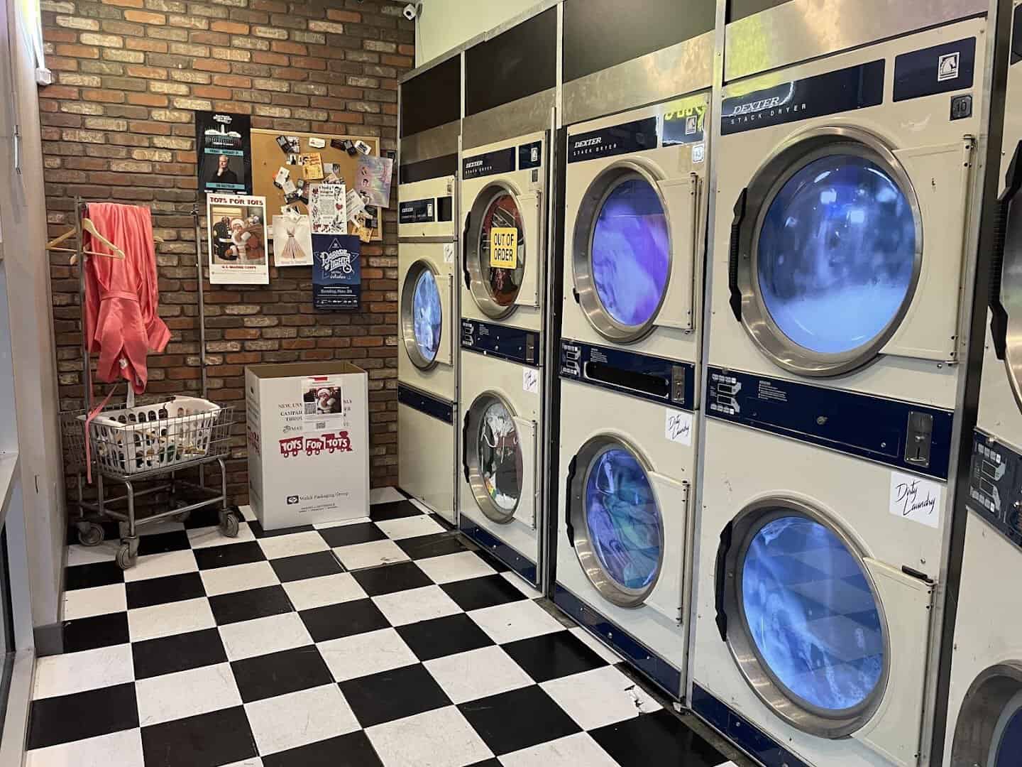 Row of front-load washers and dryers disguising the entrance at Dirty Laundry in Fort Worth