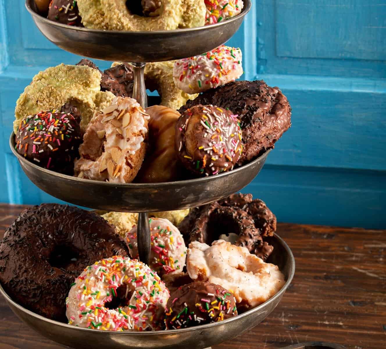 Assorted doughnuts on a tiered stand at The Doughnut Vault in Chicago, Illinois