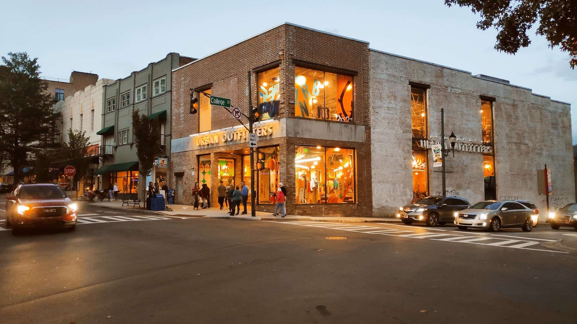 Lively downtown Asheville street corner at dusk in North Carolina