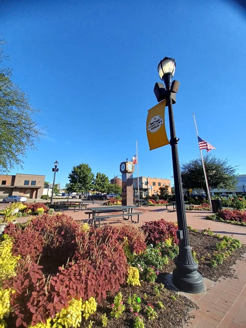 Downtown Celina banner, flags and flower beds on the town square in Celina, Texas