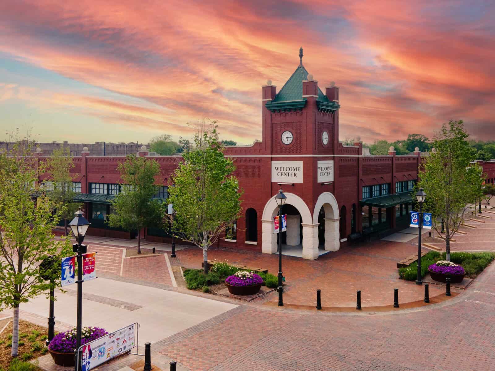 A historic brick building in Ennis Texas glowing at golden hour