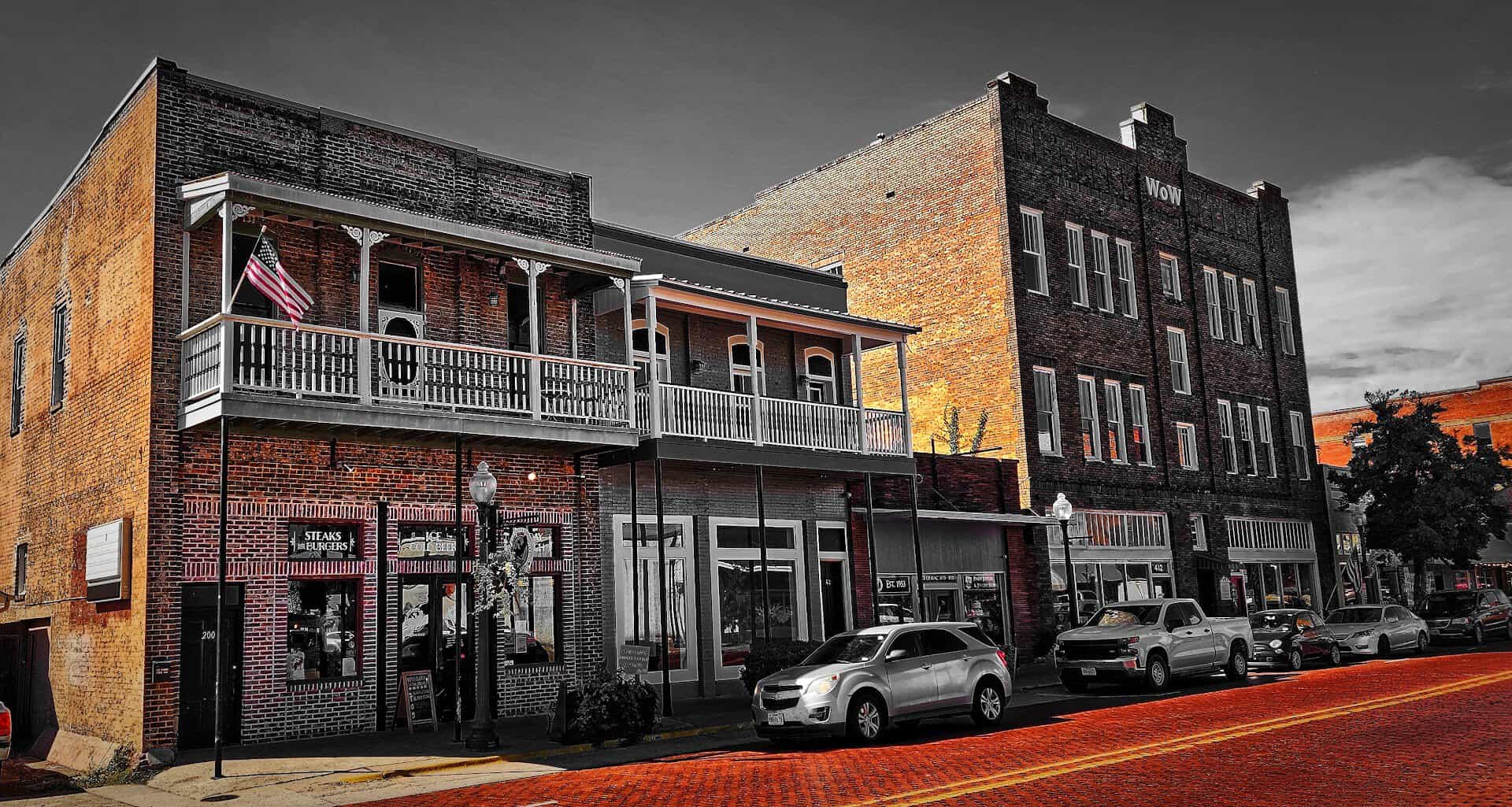 Two-story historic brick buildings along a downtown street in Nacogdoches, Texas