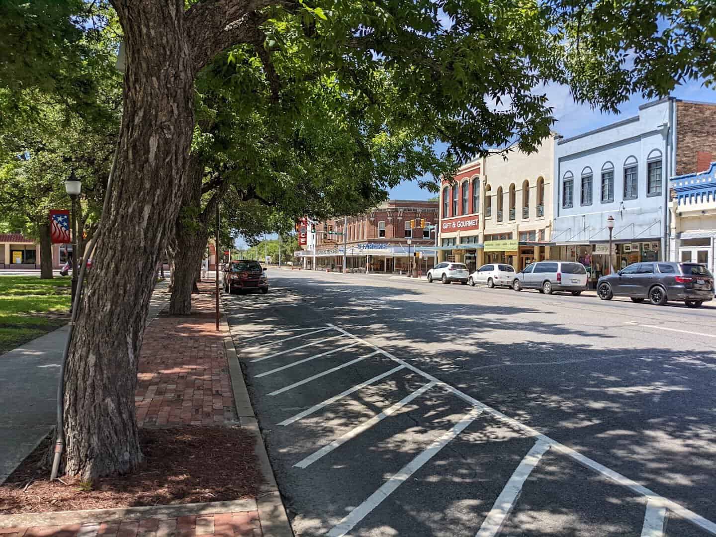 Tree-lined downtown street in Seguin, Texas