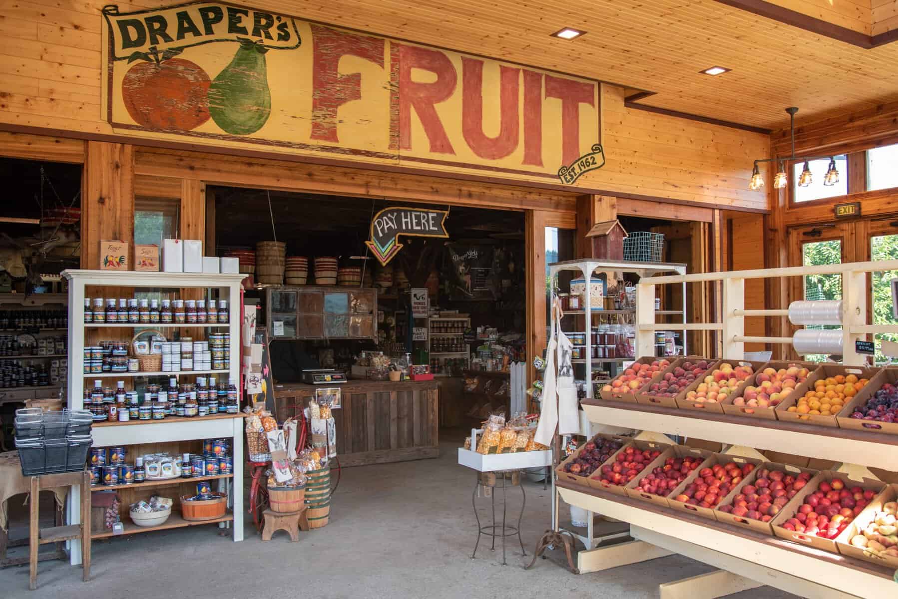 Fruit stand loaded with fresh harvest at Draper Girls Country Farm in Mount Hood Parkdale, Oregon