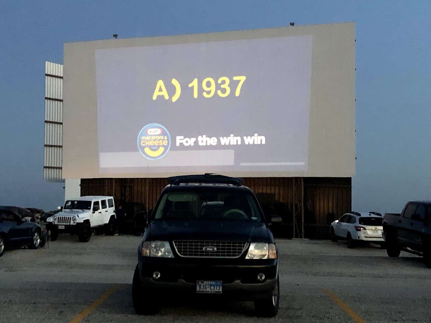 Car parked facing the big screen before showtime at the New Braunfels drive-in