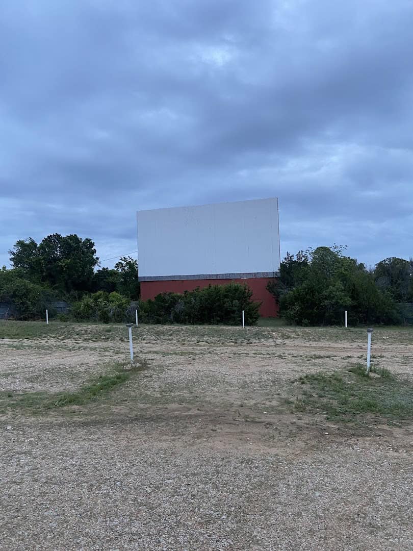 The large white drive-in movie screen at dusk at The Last Drive-In Picture Show in Gatesville, Texas