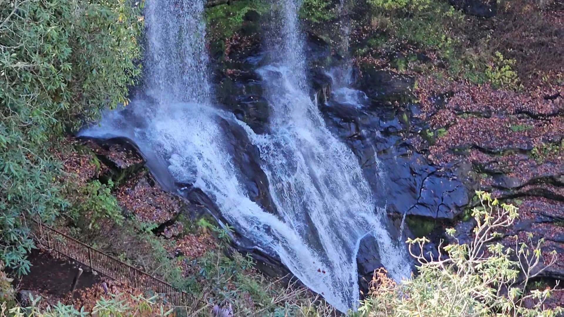 Dry Falls framed by autumn foliage near Highlands, North Carolina in fall
