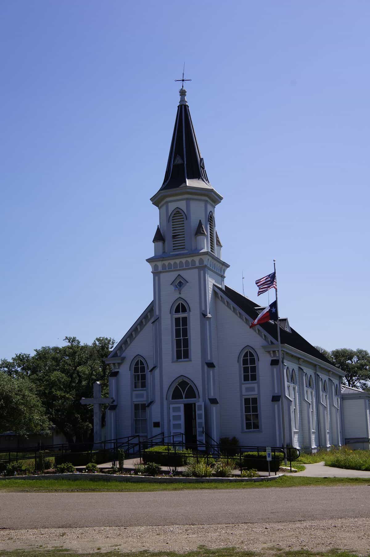 Steeple and facade of Saints Cyril and Methodius Catholic Church in Dubina, Texas
