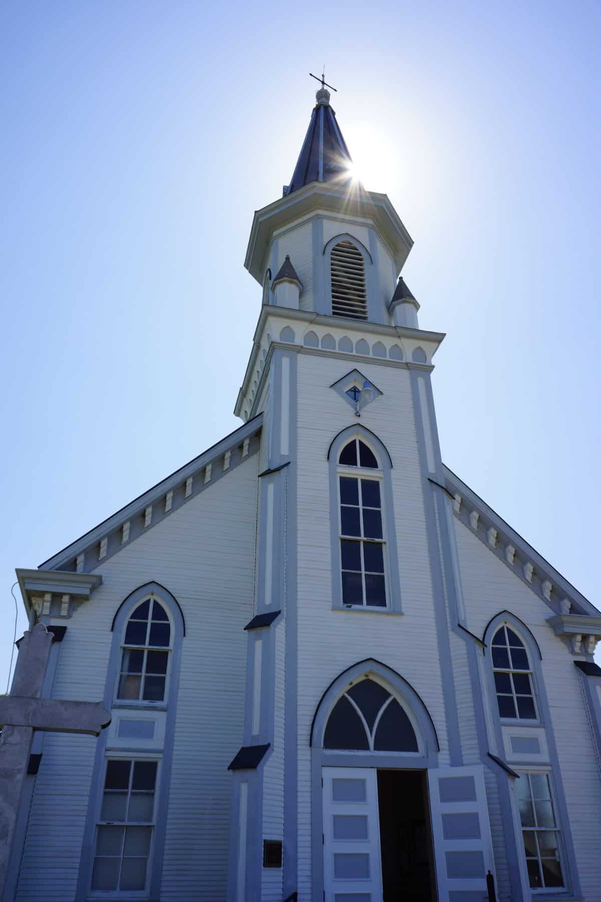White steepled front of a historic Czech Catholic church in Dubina, Texas