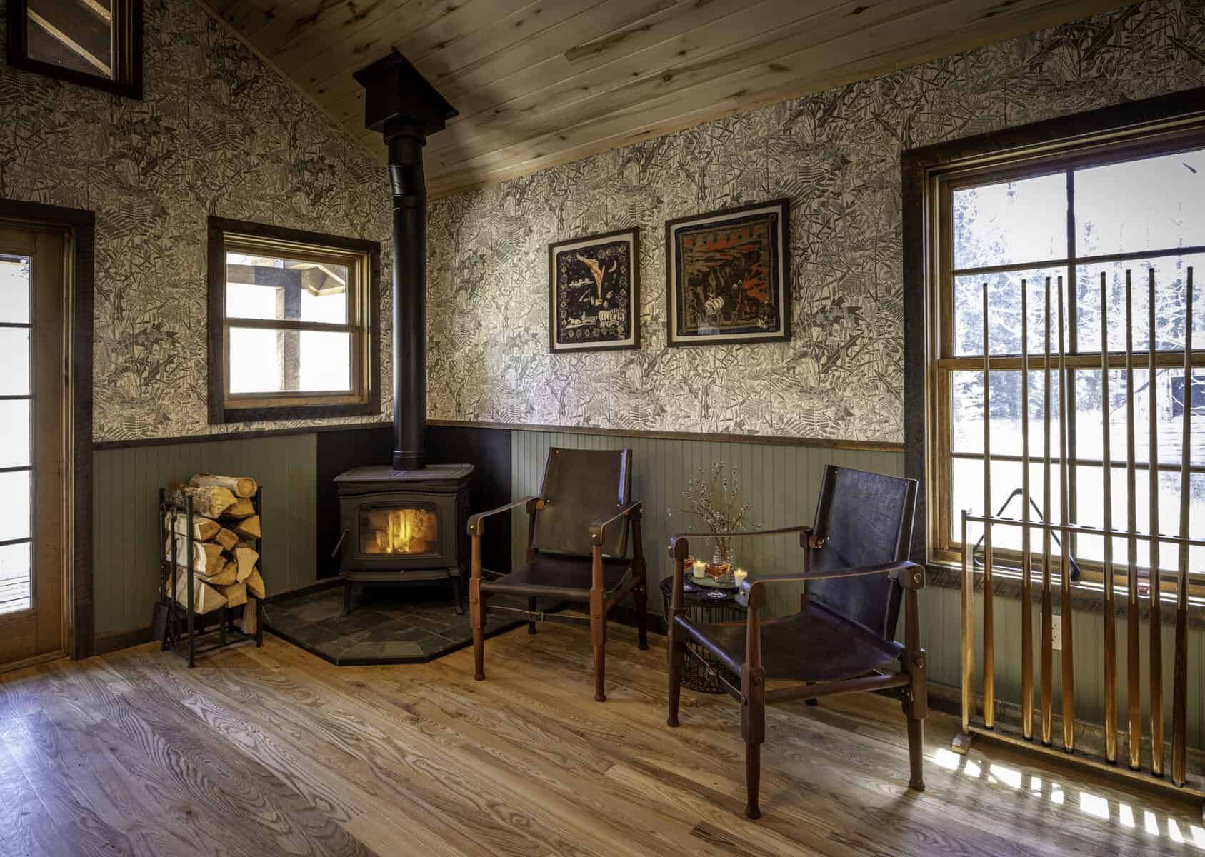 Cozy log cabin interior with a wood stove at Dunton Hot Springs in Colorado