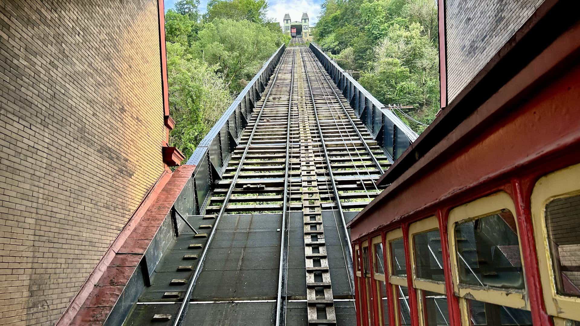 The red Duquesne Incline cable car climbing Mount Washington in Pittsburgh, Pennsylvania