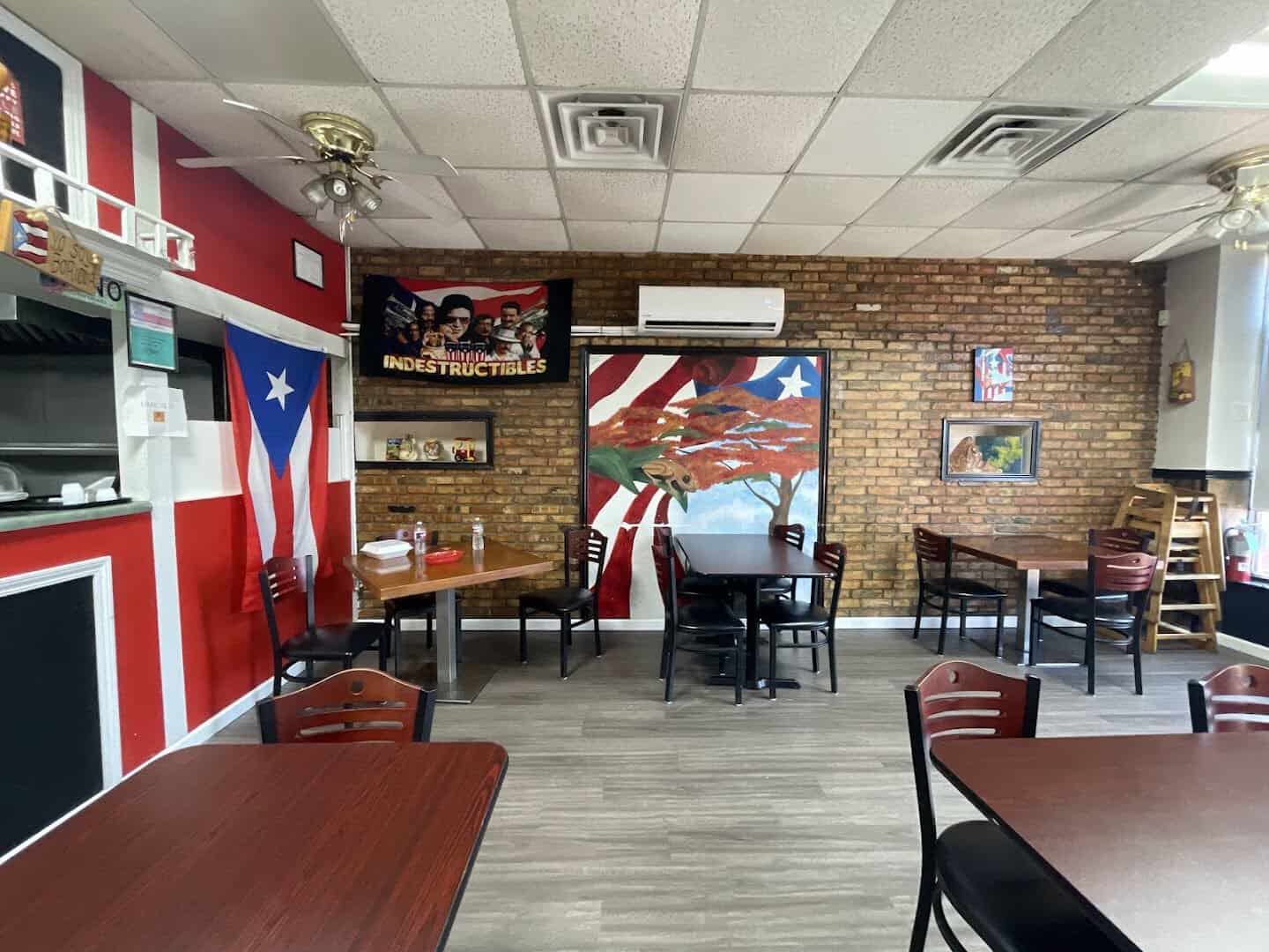 Dining room with Puerto Rican flag decor at El Flamboyan in Wylie, Texas