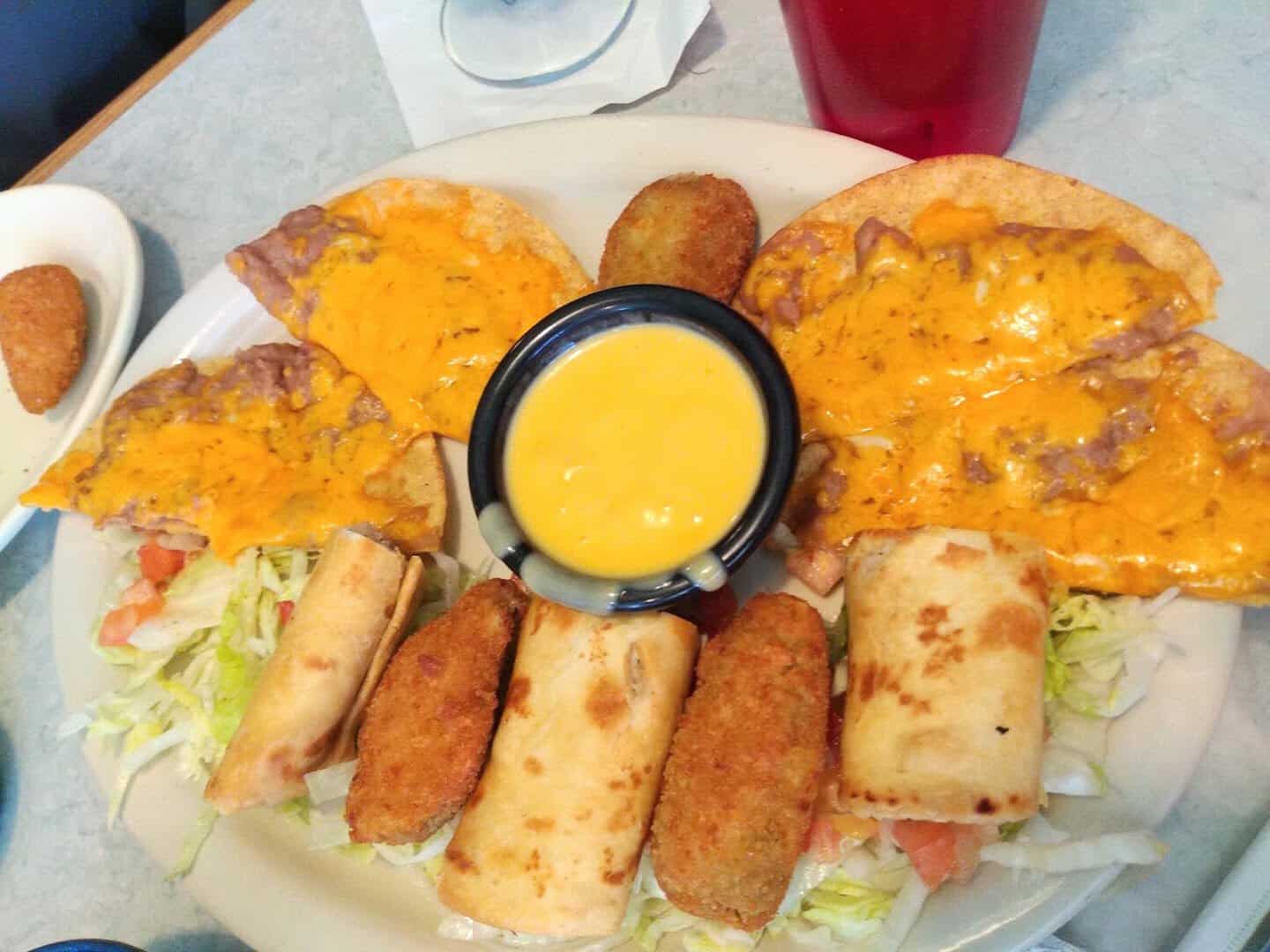 Appetizer sampler with flautas and queso at El Jacalito in Austin, Texas
