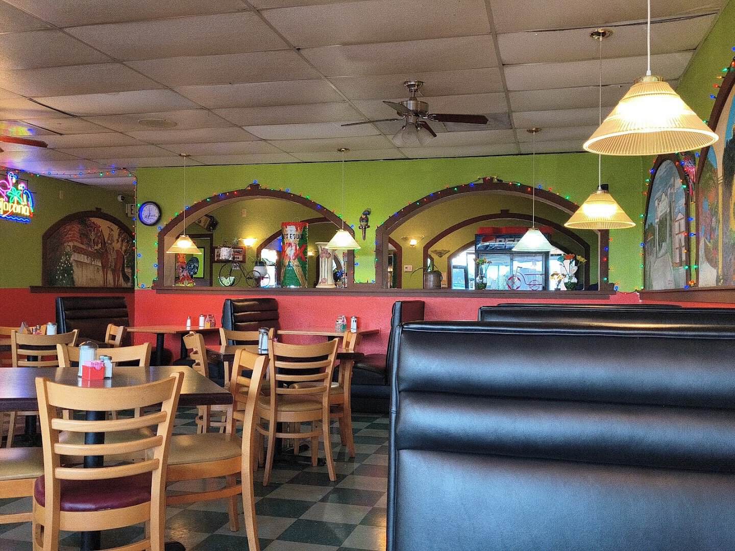 Dining room with booths at El Jacalito in Austin, Texas