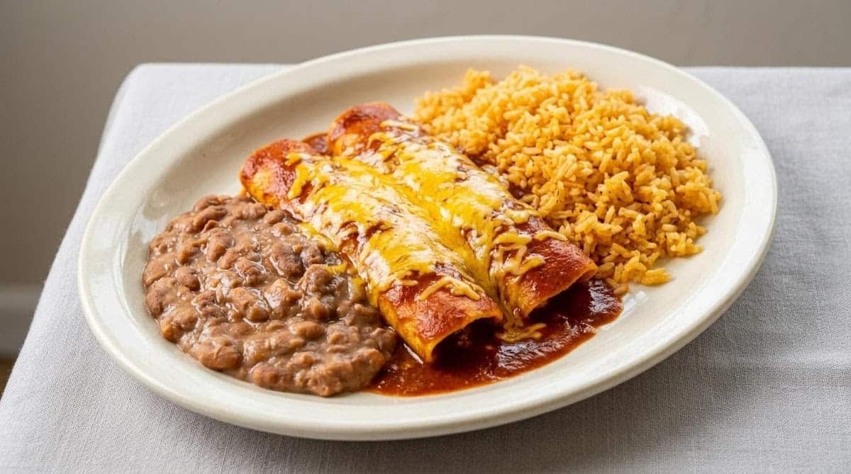 Enchiladas with Mexican rice and refried beans at El Jacalito in Austin, Texas