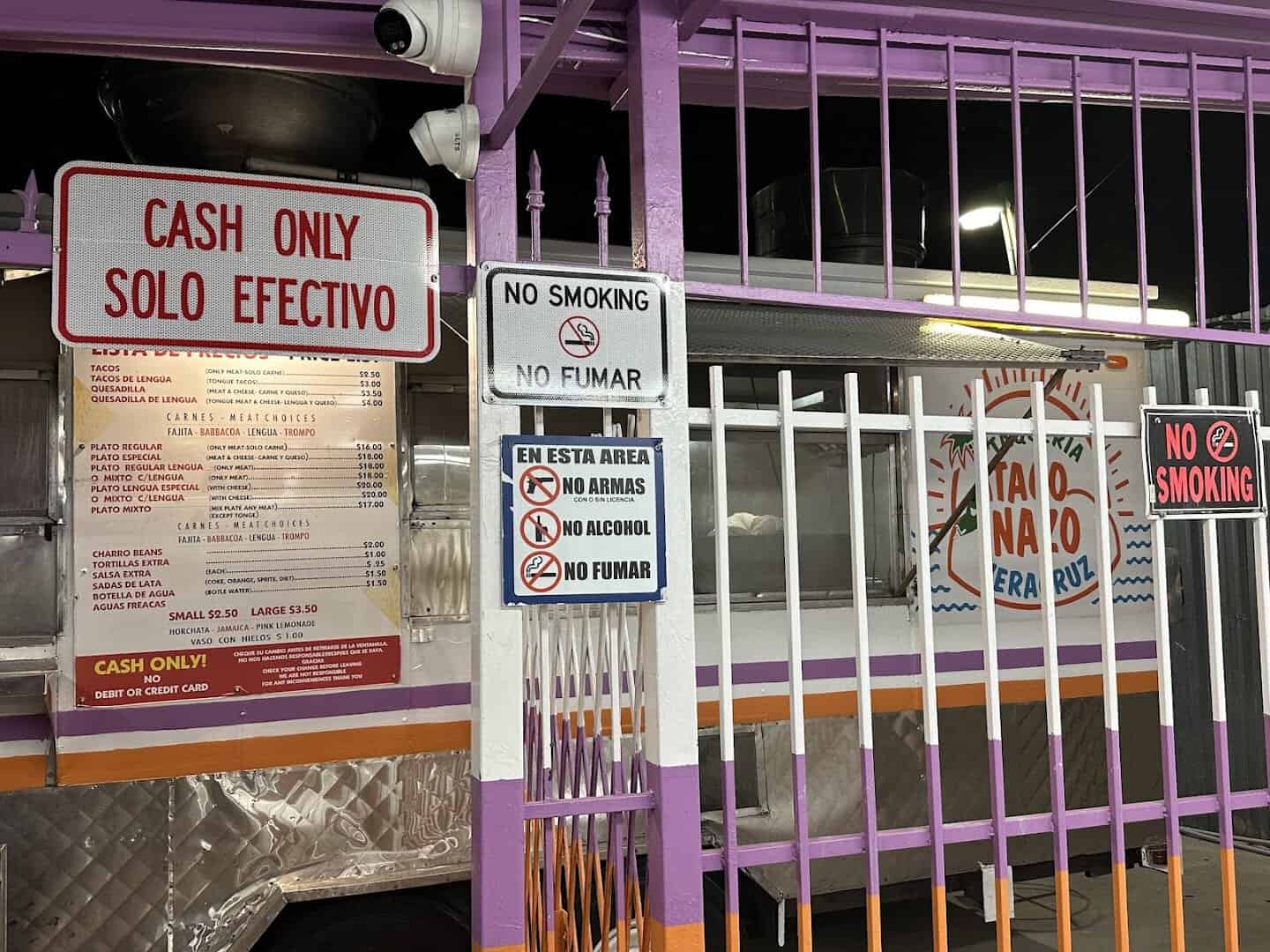 The cash-only sign and price list at El Taconazo in Houston