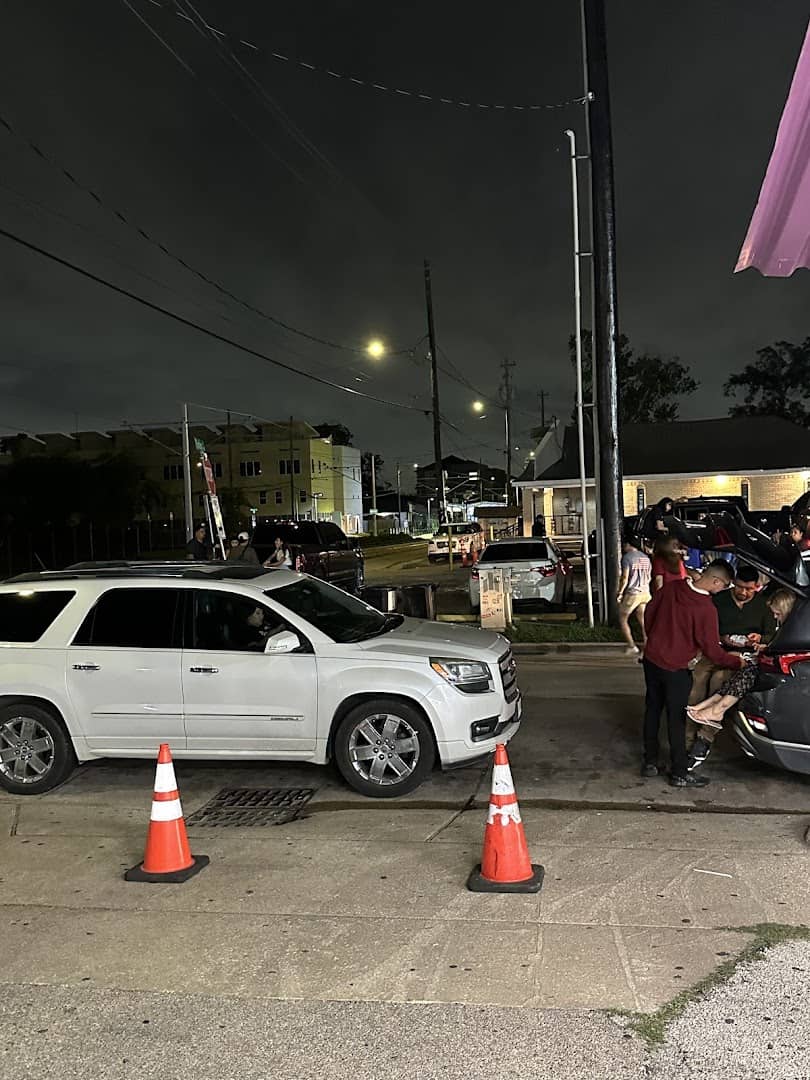 El Taconazo taco truck lit up at night in Houston