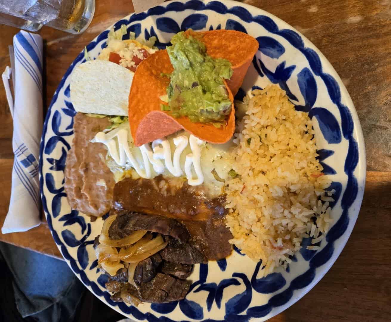 Enchiladas plate with guacamole, rice and beans at Mi Familia at the Rim in San Antonio