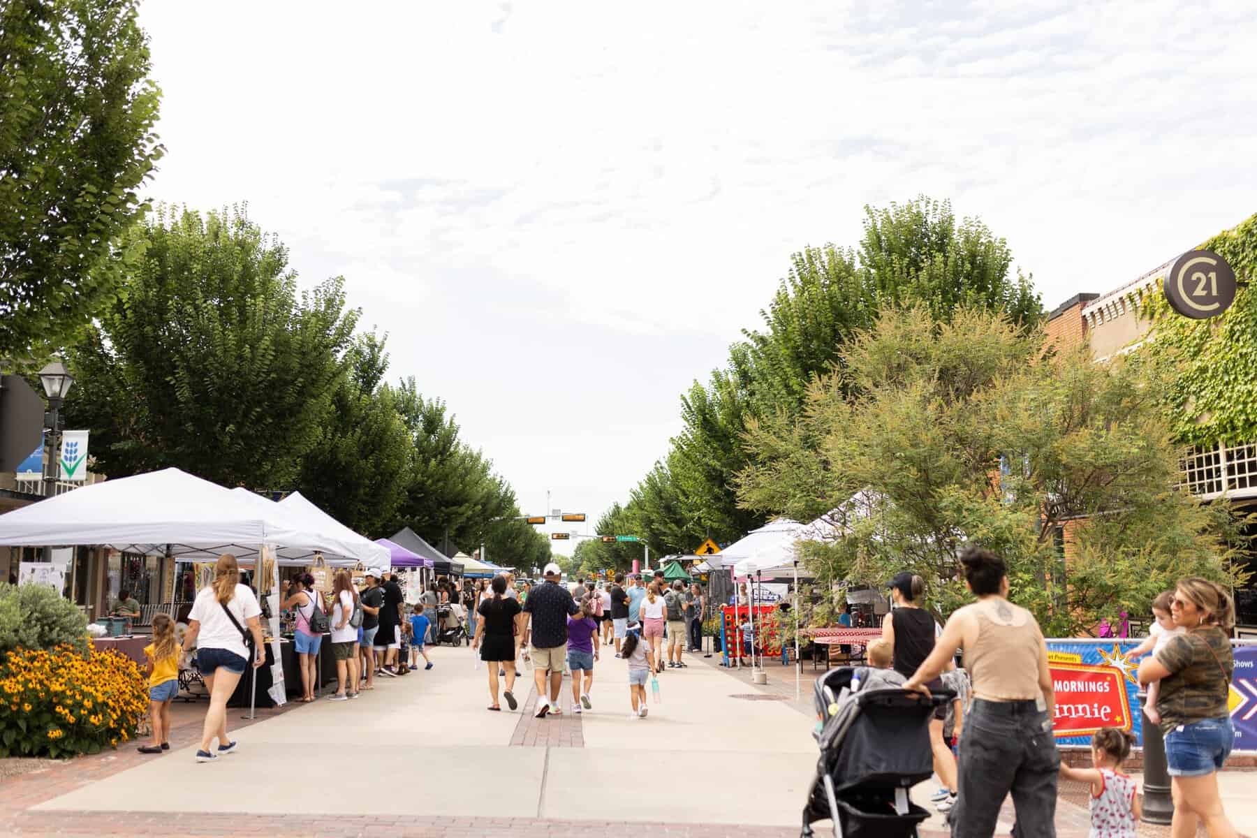 Vendor tents and crowds at the Ennis Bluebonnet Trails Festival