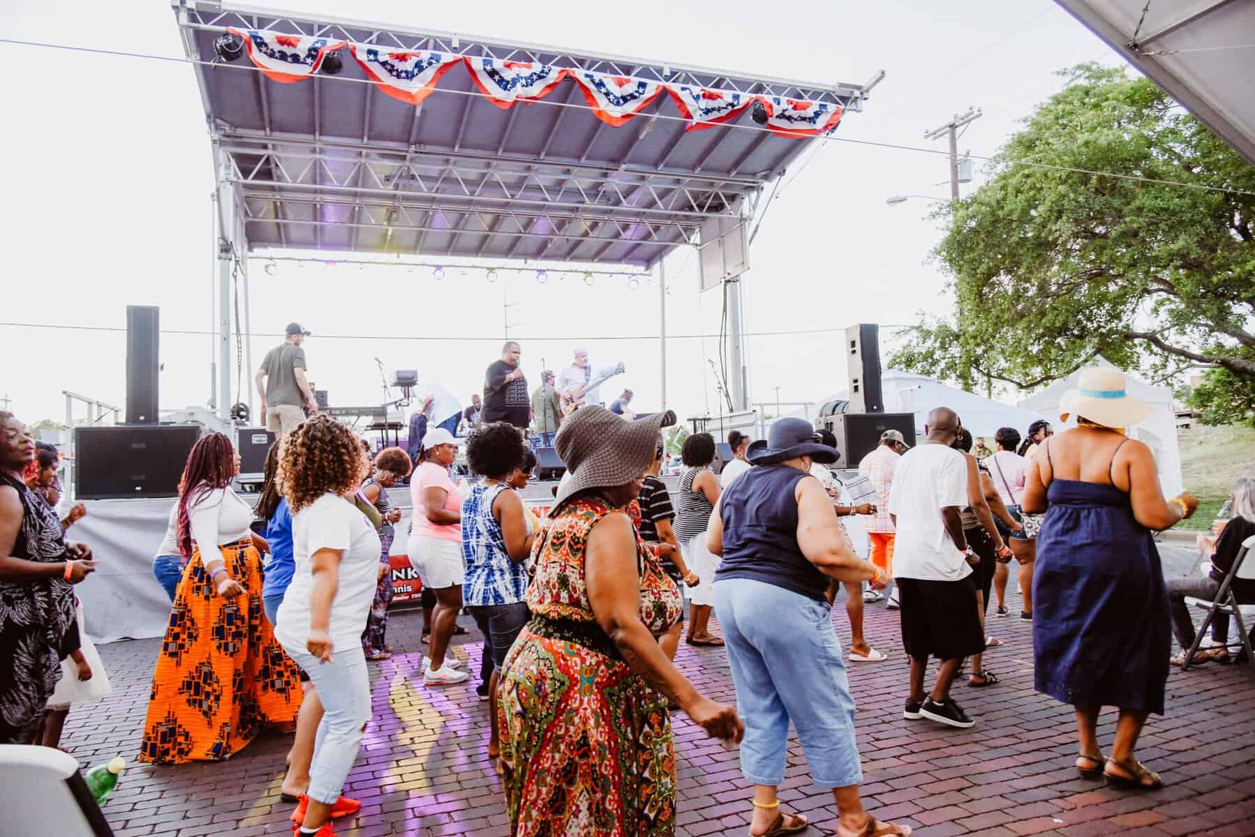Crowd enjoying live music at the Ennis Bluebonnet Trails Festival