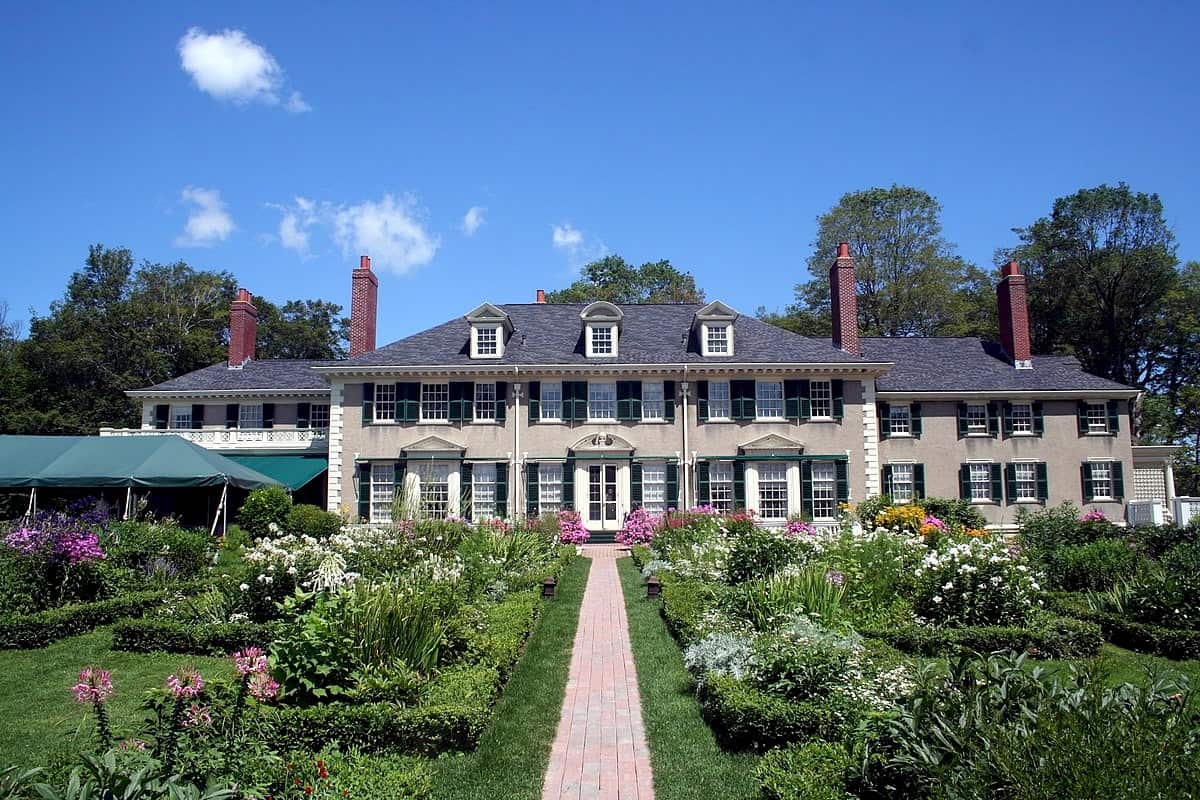 The Equinox Golf Resort and Spa white columned exterior with gardens in Manchester Village, Vermont