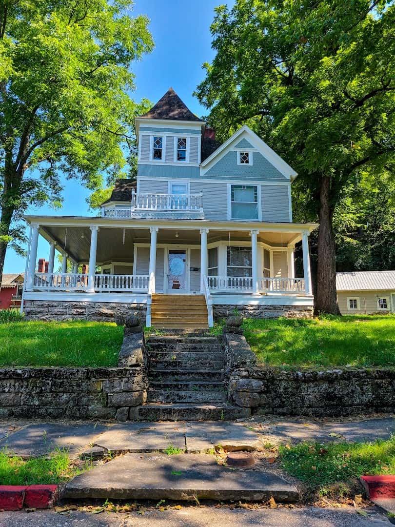 Victorian gingerbread house on a hillside street in Eureka Springs, Arkansas