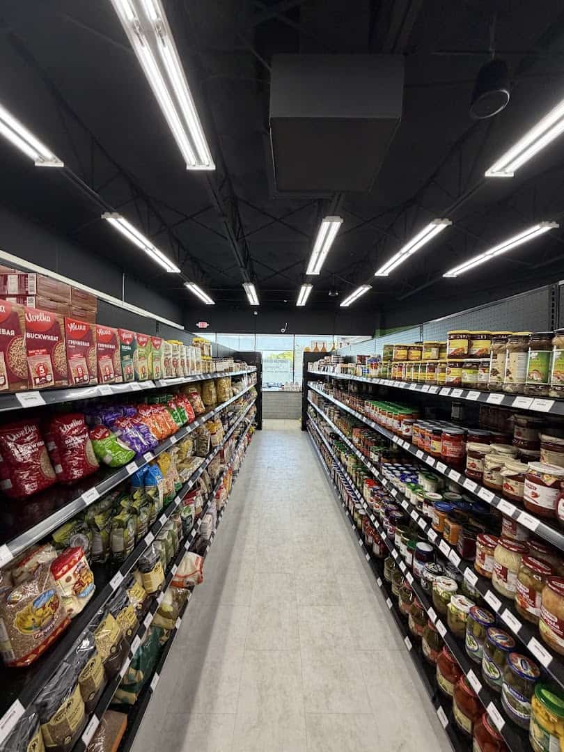 Fully stocked grain and pasta aisle at Gourmet European Market in Dallas
